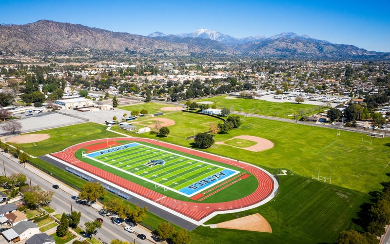 Drone Shot Of Azusa'S Football Field And Track With Baseball Fields In The Background