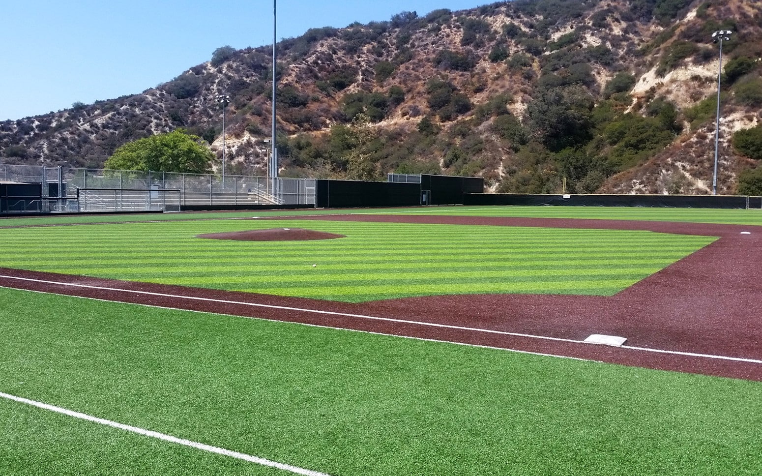 Ball field batting mound, field and bleachers